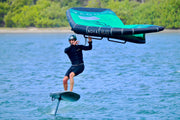 A coach showing how to turn wing foiling